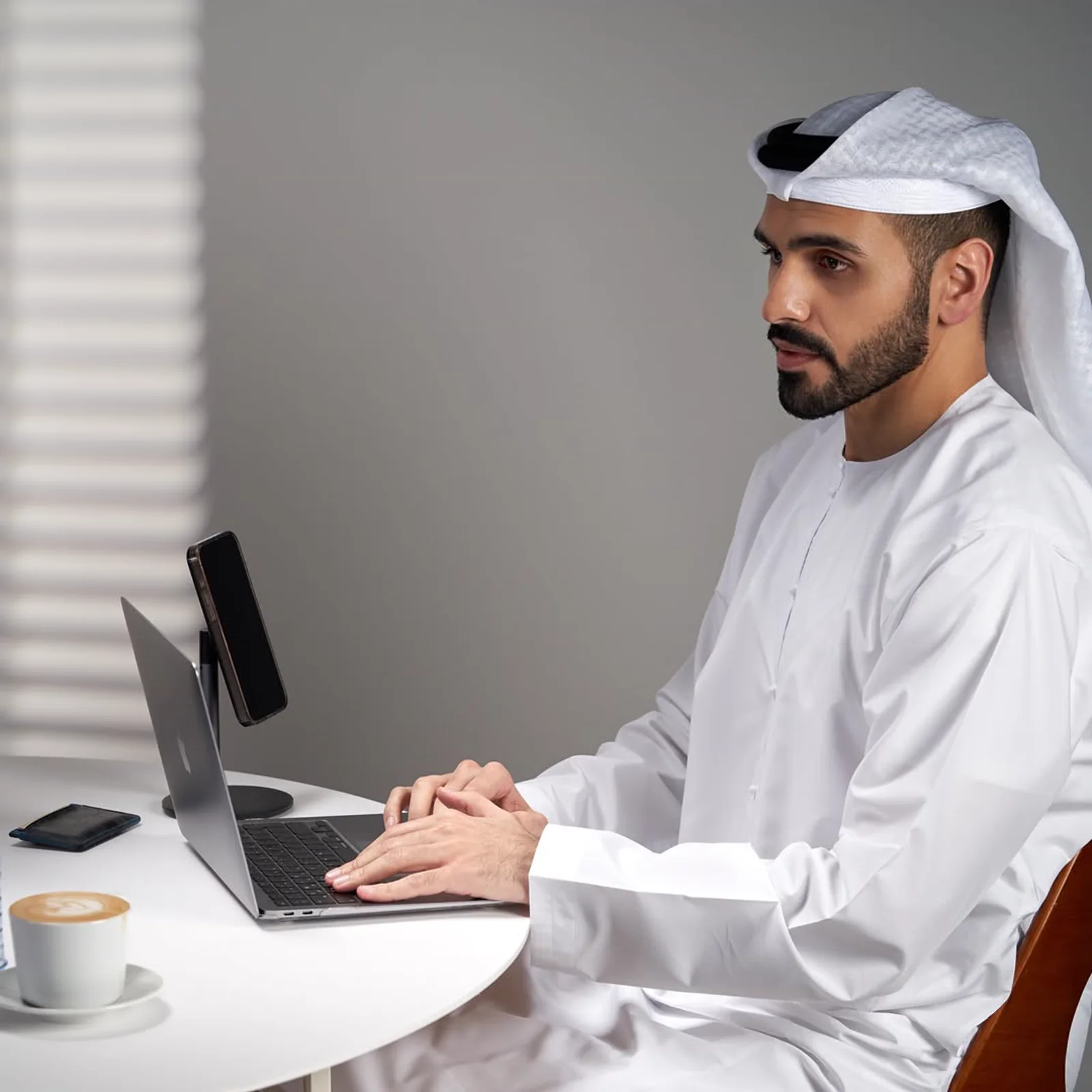 Ahmed AlDhraif working at a laptop